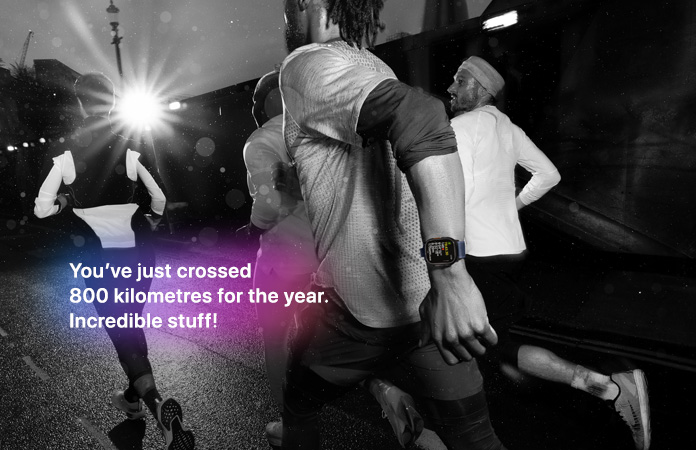 Black-and-white photo of people jogging, text over photo says You’ve just crossed 800 kilometres for the year. Incredible stuff!