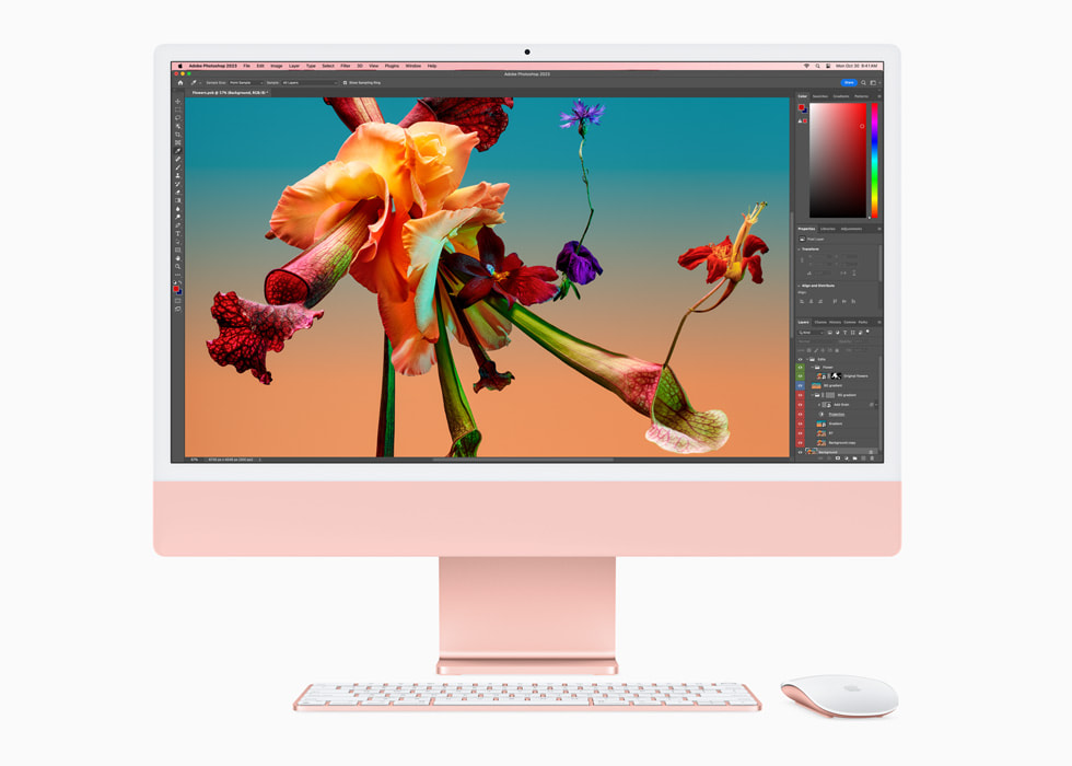 Adobe Photoshop ditampilkan pada iMac baru dengan M3 berwarna merah muda dengan papan ketik dan tetikus berwarna senada.