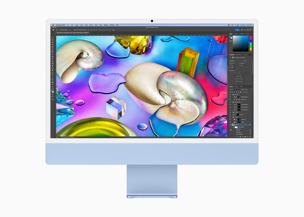 Mavi bir iMac’te bir kullan?c? Photoshop kullan?yor.