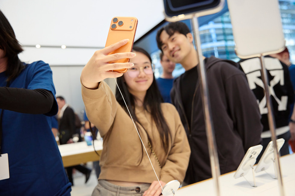 Two happy customers take a selfie using iPhone 17 Pro at Apple Sydney in Sydney, Australia.