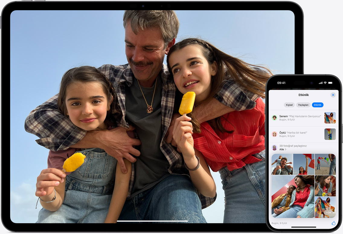 iPad ve iPhone ekran?ndaki iCloud Foto?raflar?’nda bir baba ile iki k?z?n?n kumsaldaki g?rüntüleri yer al?yor