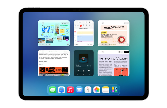 Un iPad, posición horizontal, la pantalla muestra seis ventanas abiertas en dos filas, incluidas las apps Calendario, Notas, Apple Music y Safari