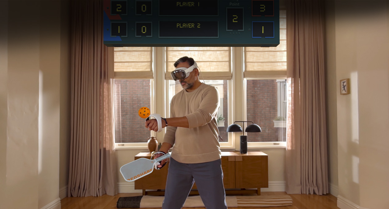 Man wearing Apple Vision Pro and Sony PlayStation VR2 Sense Controller playing: Pickle Pro game, a spatial scoreboard above his head
