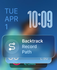 Three Apple Watch models, center Apple Watch Ultra 2 in Natural Titanium with Black Trail Loop band, face shows Watch app and Backtrack widget, right Apple Watch in Jet Black with Aquamarine Braided Solo Loop band, face shows Live Translation conversation with Grandma, left Apple Watch in Silver with Tangerine Sport band, face shows Outdoor Run with play button in Workout app