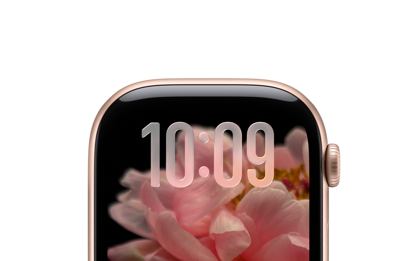 Un Apple Watch color oro rosa, sin correa, y sólo la parte superior de la carátula es visible, donde cerca del borde superior se aprecian números traslúcidos con el dise?o con Liquid Glass